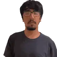 a man wearing glasses and a black shirt is making a gesture