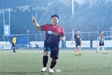 a soccer player wearing a jersey that says ' unia ' on the front
