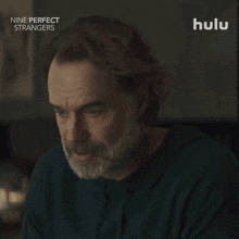 an advertisement for nine perfect strangers shows a man with a beard saying " yes "