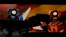 a blue robot and a red robot are standing next to each other in a room