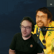 a man wearing headphones and a yellow shirt with the number 15 on the bottom right
