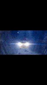a yellow submarine with a purple propeller is swimming in the ocean