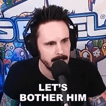 a man wearing headphones and a mustache is talking into a microphone and says let 's bother him
