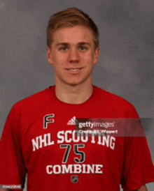 a young man in a red nhl scouting 75 combine shirt