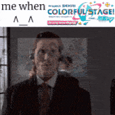 a man in a suit and tie is standing in front of a sign that says me when colorful stage