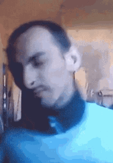 a pixelated image of a man with a mustache