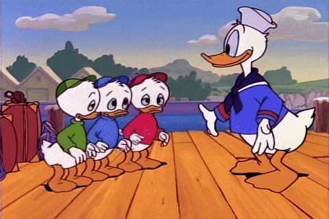 The duckling nephews hug Donald
