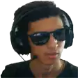 a man wearing sunglasses and headphones is looking at the camera .
