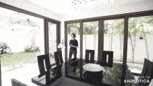 a woman is standing in a dining room with a table and chairs made in animotica