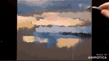 a painting is being painted on a canvas with the words made in animatica on the bottom