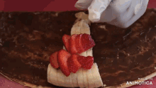 a person is making a dessert with strawberries and bananas and the words made in animotica on the bottom
