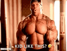 a very muscular man is standing in a gym and saying `` kid like this ? ''
