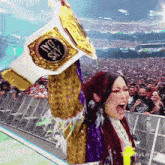 a woman in a purple and gold outfit is holding up a no sky belt