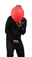 a man in a black shirt holds a red balloon in his hands