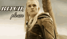 a man with long blonde hair is standing in front of a sign that says bitch please .