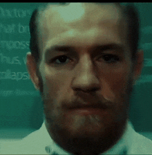 a close up of a man 's face with the word doctors behind him