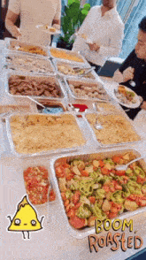 several trays of food are on a table with the words boom roasted on the bottom