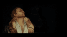 a video game screen shows a man in a fur coat saying " go lable yagase fibitch "