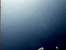 a dark blue background with a few white dots