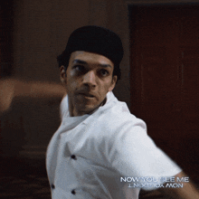 a man in a chef 's uniform with the words now you see me now you don 't on the bottom
