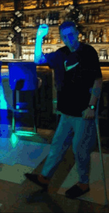 a man with crutches and a nike shirt on