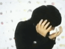 a blurry picture of a person holding a yellow object
