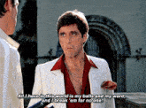 a man in a white suit and red shirt says all i have in this world is my balls and my word