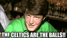 a man in a green shirt says " the celtics are the balls !! "
