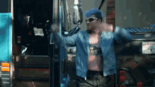 a man with purple hair and sunglasses is standing in front of a truck that says porta
