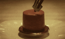 a piece of chocolate cake with a fork sticking out of it
