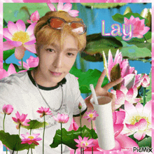 a picture of a man surrounded by pink flowers with the name lay written in pink