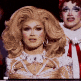 a close up of a drag queen 's face with the time of 17:16 on the bottom