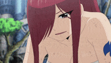 a girl with long red hair has a tattoo on her arm