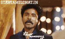 a man with a mustache and the words starttamilchat.in on the bottom