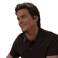 a man in a black polo shirt is smiling and looking to the side