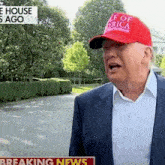 a man wearing a red hat that says ' f of america '