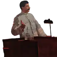 a man with a mustache is giving a thumbs up while standing at a podium
