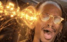 a man wearing glasses is singing with music notes coming out of his ear