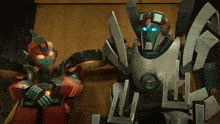 two robots are standing next to each other and one of them has a blue eye