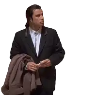 a man in a suit and tie is holding a jacket