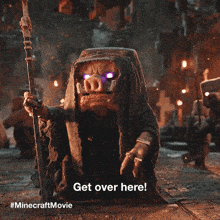 a pig with purple eyes is holding a stick and says " get over here "
