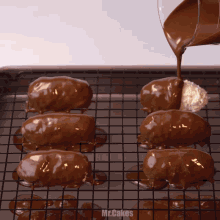 a tray of chocolate covered treats with the words mr.cakes written on the bottom