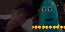 a man laying in bed next to a picture of a blue monster with smiley faces on it