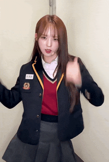 a girl in a school uniform has a name tag on her jacket that says ' a ' on it