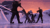 a group of people standing in the snow with a purple sky behind them