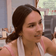 a woman is on the great canadian baking show making a face