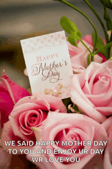 a bouquet of pink roses with a card that says happy mothers day