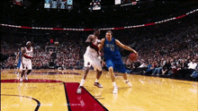 a basketball player in a blue jersey with the number 31 on it