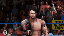 a man in a wrestling ring holding a belt that says ' this is my sign ' on it