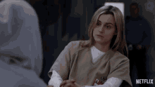 a woman with a name tag that says ' netflix ' on the bottom